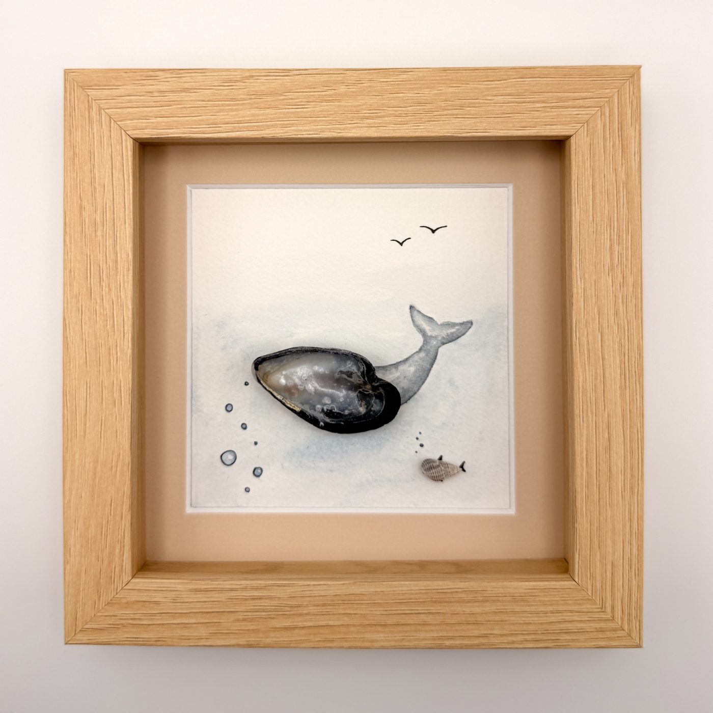 Mussel shell whale with a small fish