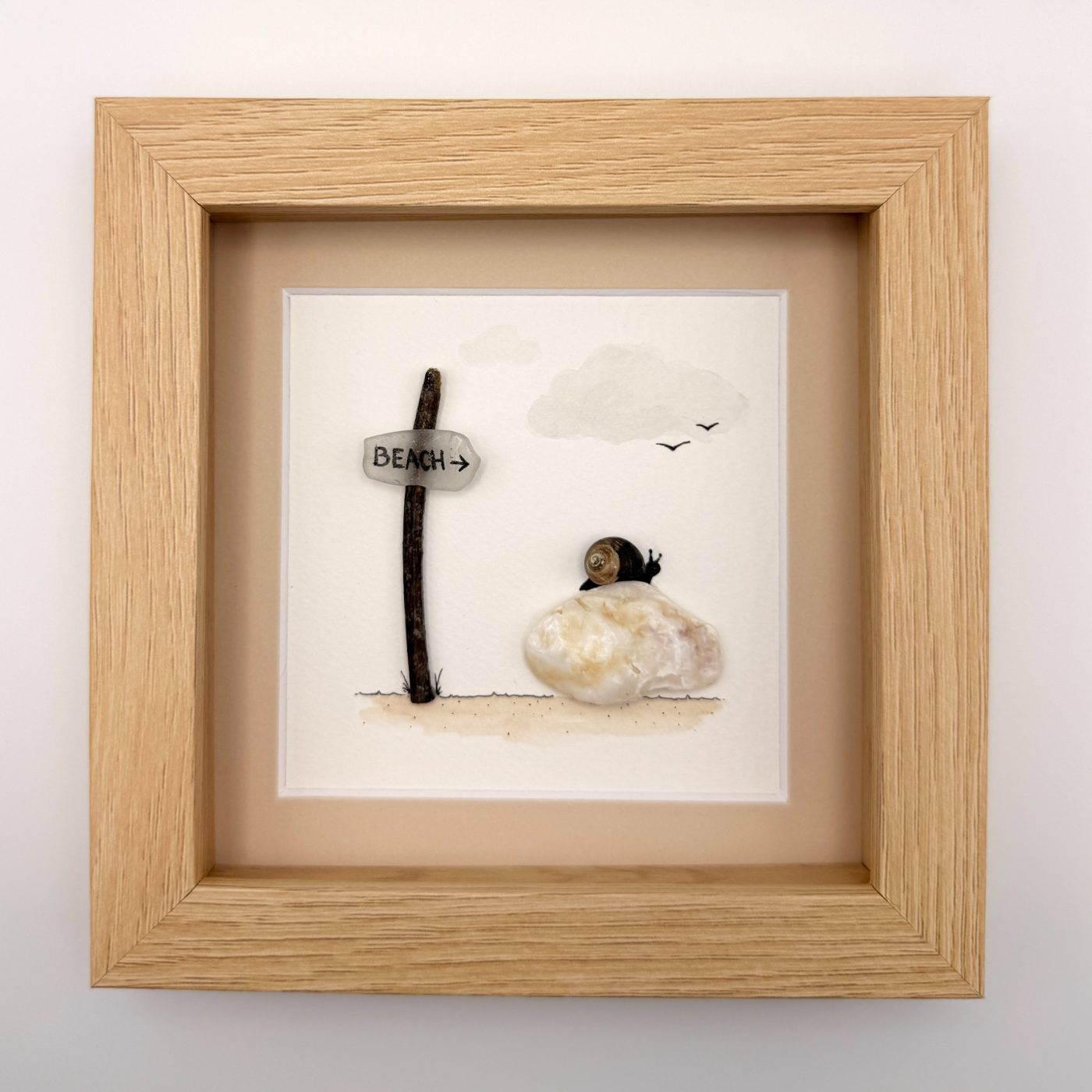 Sea glass beach sign with a snail