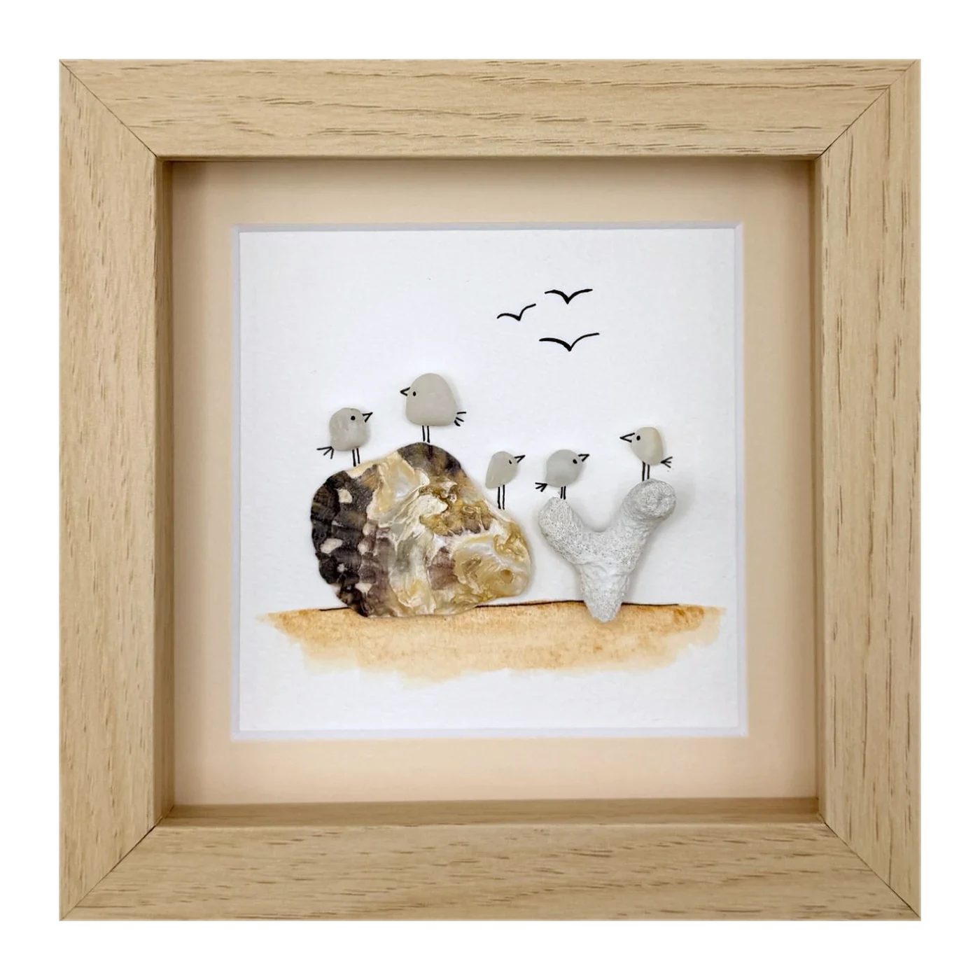 Five sea glass birds on shell and coral