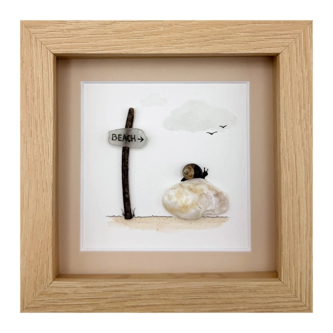 A sea glass beach sign with a snail