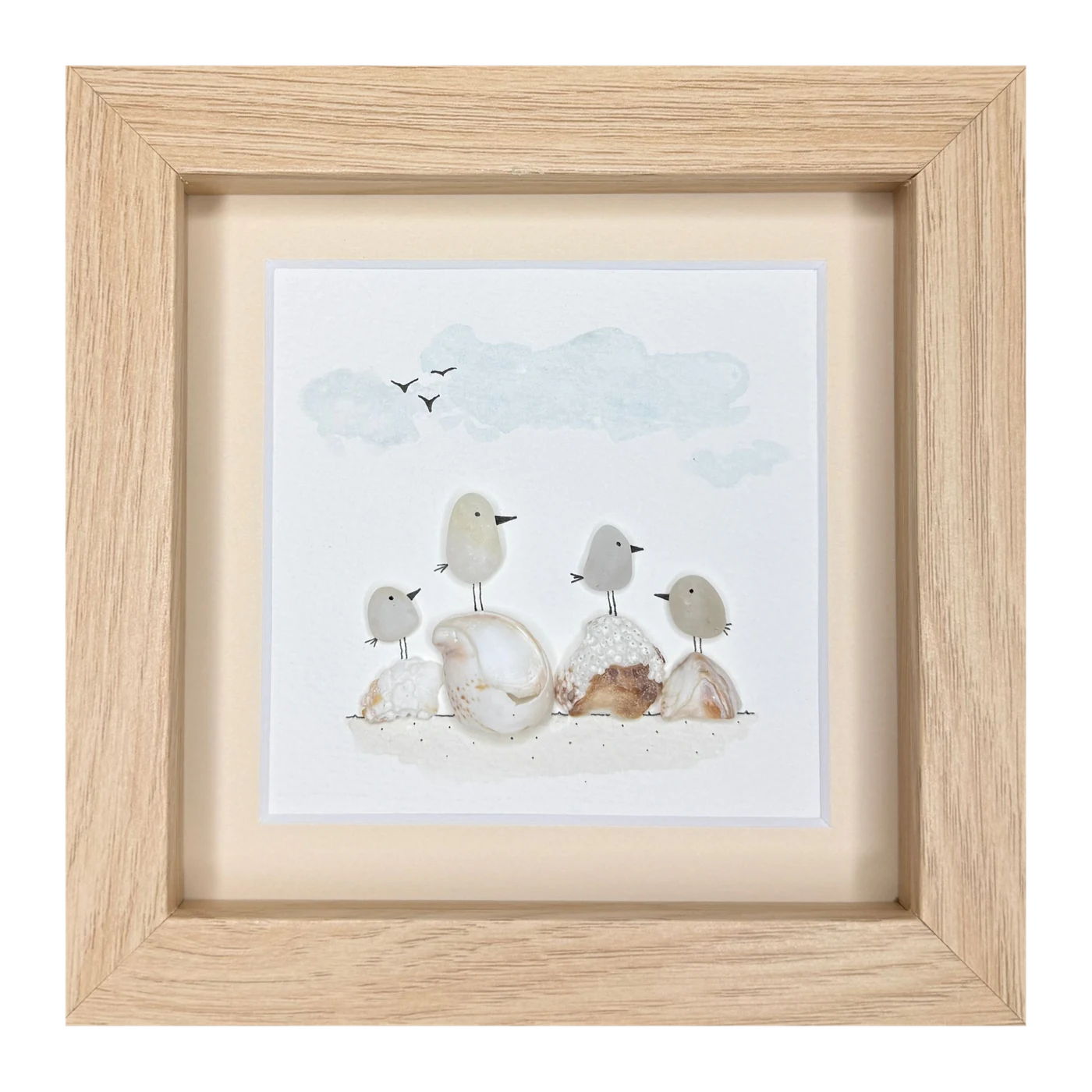 Four pale stone birds on shells along the shore, under a watercolor sky with three gulls